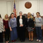 Newly appointed Court Appointed Special Advocates stand in Bartholomew County Circuit Court after being sworn in.  From Left to Right, Alex Clark, Sarah Haefner, Gwedolyn Amos, Katrina Poling, Johnnie Trenkamp, Carolyn Titara, and Kenneth Gauck.