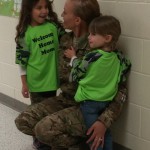 Sgt. Mary Everroad returns after a one-year tour in Afghanistan, to surprise her daughters at their schools Friday.