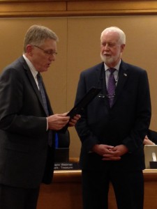 Mayor Jim Lienhoop stands next to City Councilman Tom Dell as reads Tuesday evening's proclamation.