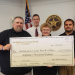 Real World Testing helped Bartholomew County emergency dispatcher Dylan Prather raise money to buy a second police dog for the Bartholomew County Sheriff's Department by donating $18,000.  Pictured are Dean Howard, April Gray and  Jason Burton with Real World Testing and Prather in the back row. 