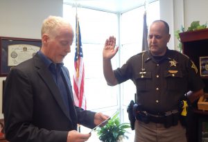 Martoccia being sworn-in by Sheriff Matt Myers