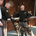 Dylan Prather, Sheriff Matt Myers and Deputy Matt Bush with police dog Diesel at Monday morning's Bartholomew County Commissioners meeting.