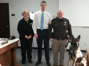 New police dog Diesel received his badge at today's Bartholomew County Commissioners. meeting. With Deputy Matt Bush, Dylan M. Prather and April Gray, from Real World Testing. Prather raised $18,000 for the purchase of the dog with Real World Testing providing the majority of the money.